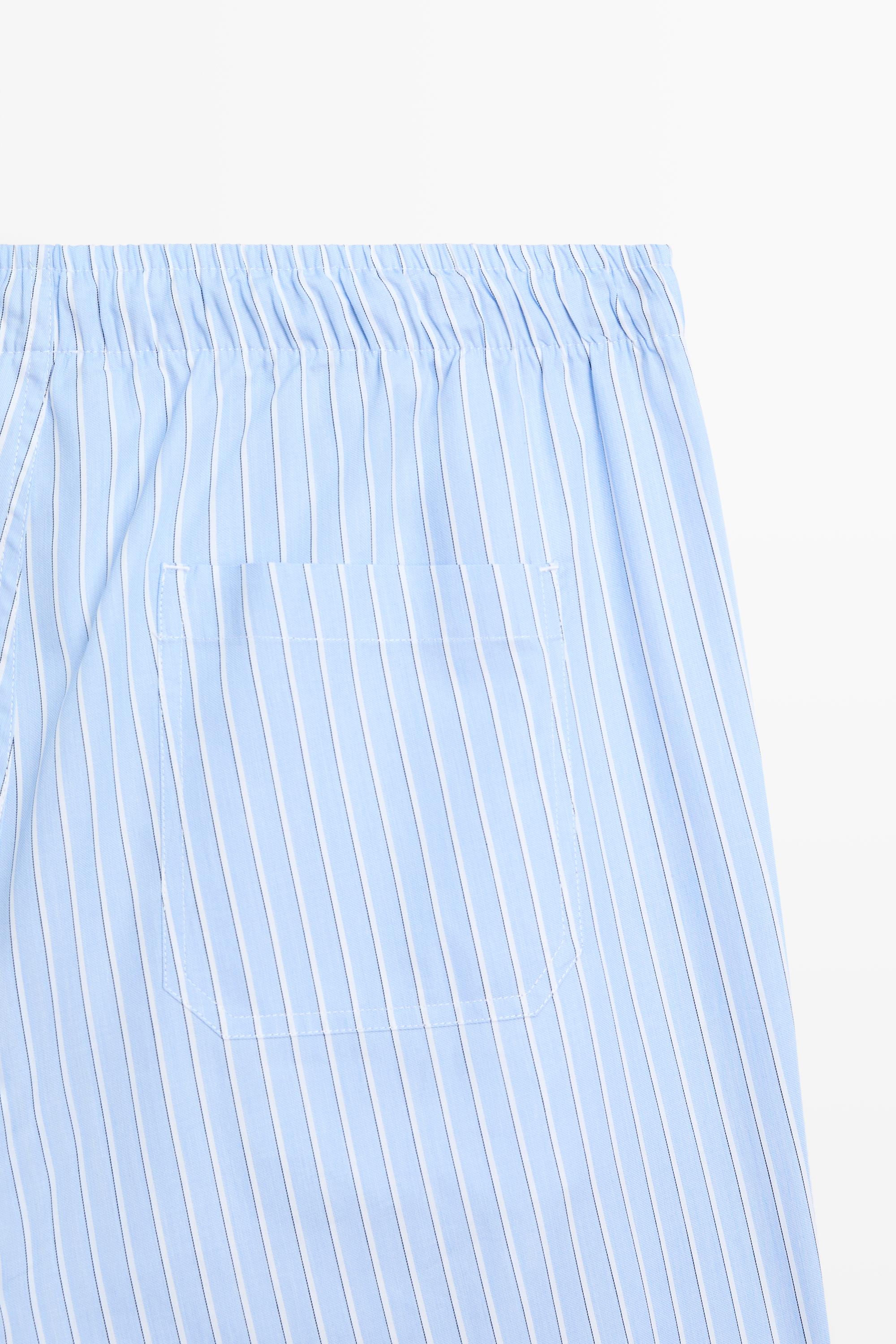 Short sleeve pyjama top and striped trousers