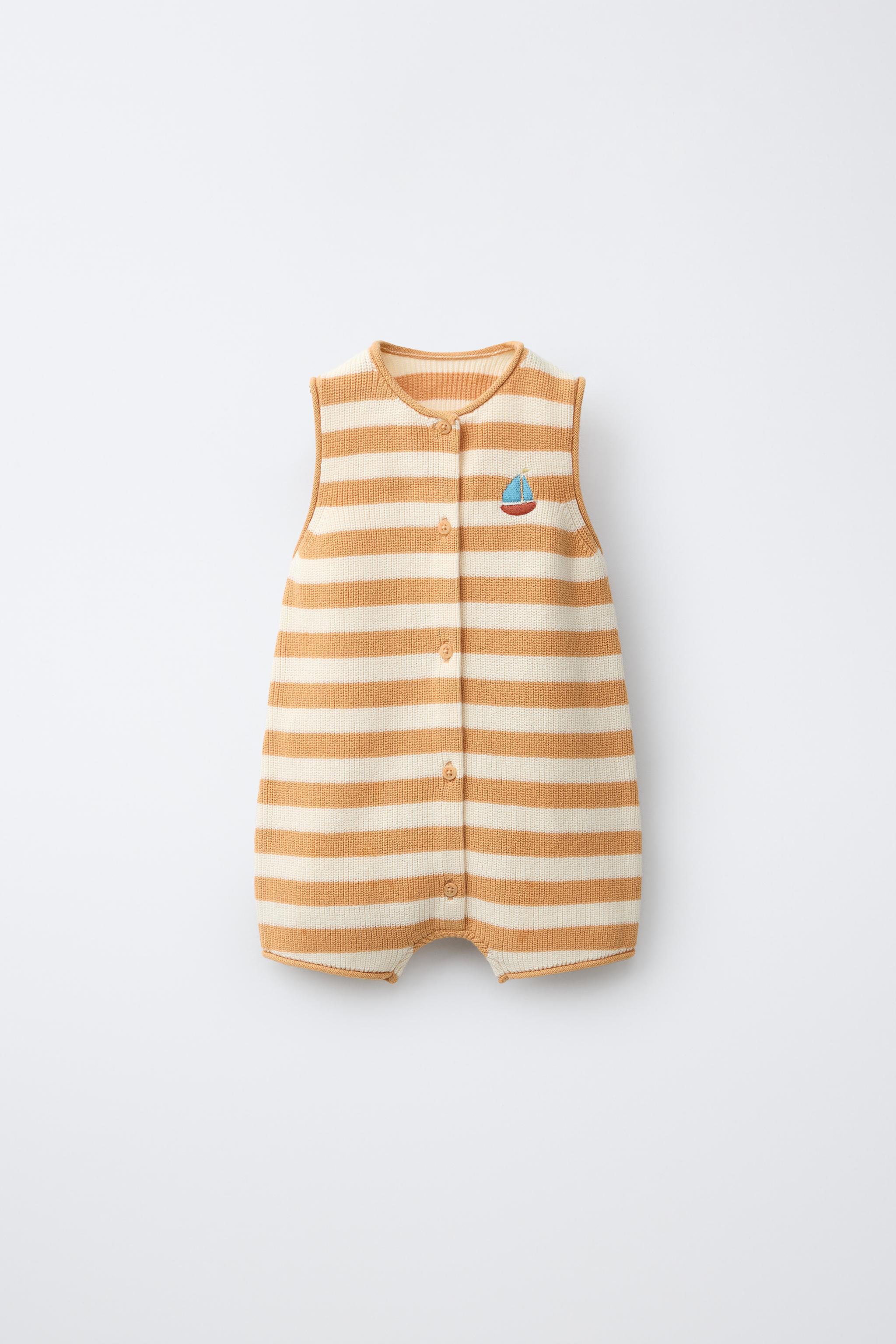 STRIPED KNIT ROMPER WITH EMBROIDERED BOAT