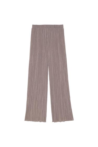 Light brown pleated wide-leg trousers with an elasticated waistband, laid flat on a white background.