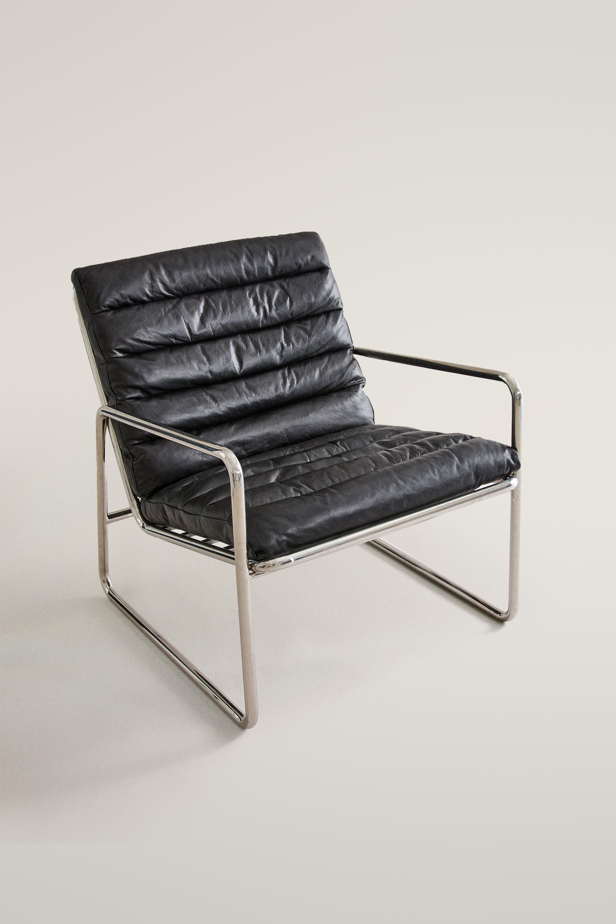 LEATHER AND STAINLESS STEEL ACCENT CHAIR