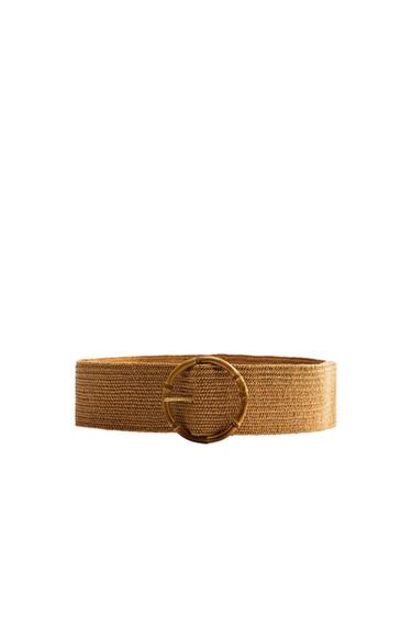 Front view of a wide brown belt with a round gold buckle.