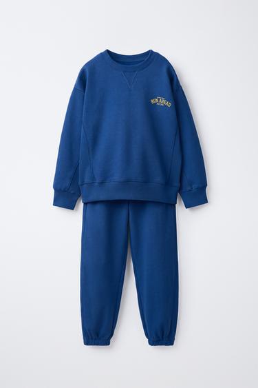 CONJUNT DESSUAORA I PANTALONS JOGGER MISSATGE VARSITY - Blau de Zara
