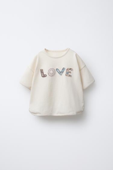 تي شيرت بنص ورقعات - خَام الخاص بـ Zara