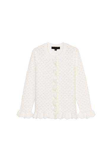 Textured white knitted cardigan, long sleeves, round neck, front buttons, and ruffles on the cuffs and hem on a white background.
