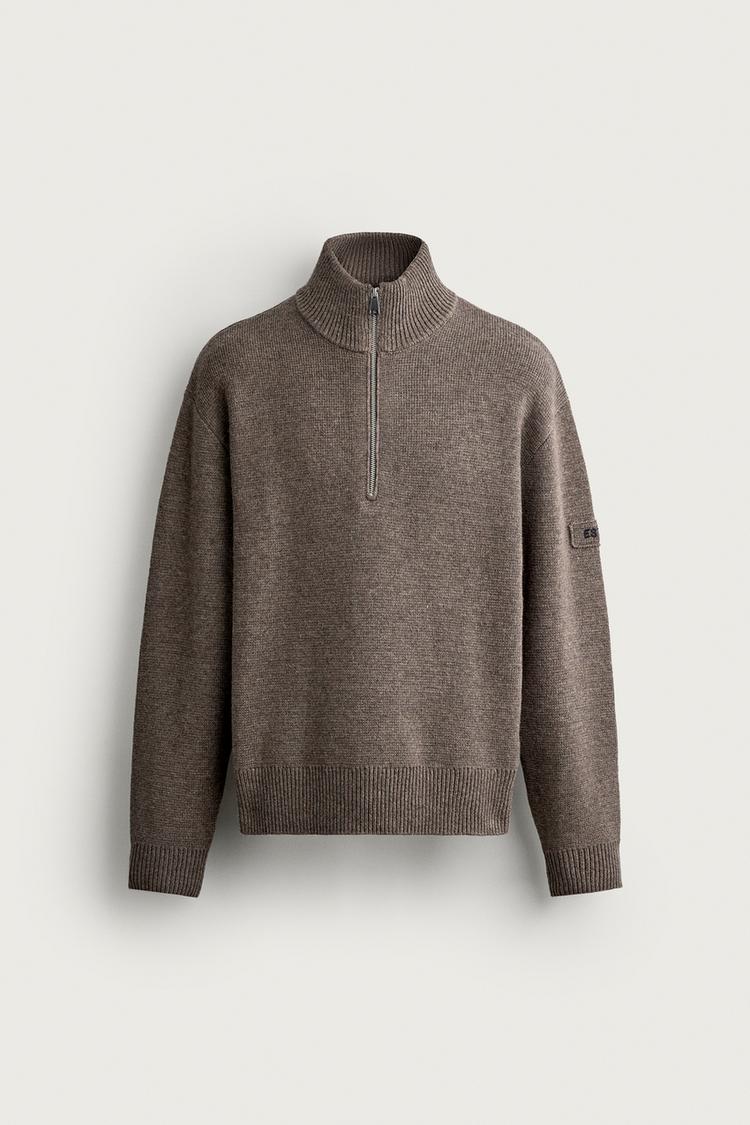 Jersey cuello cremallera bordado