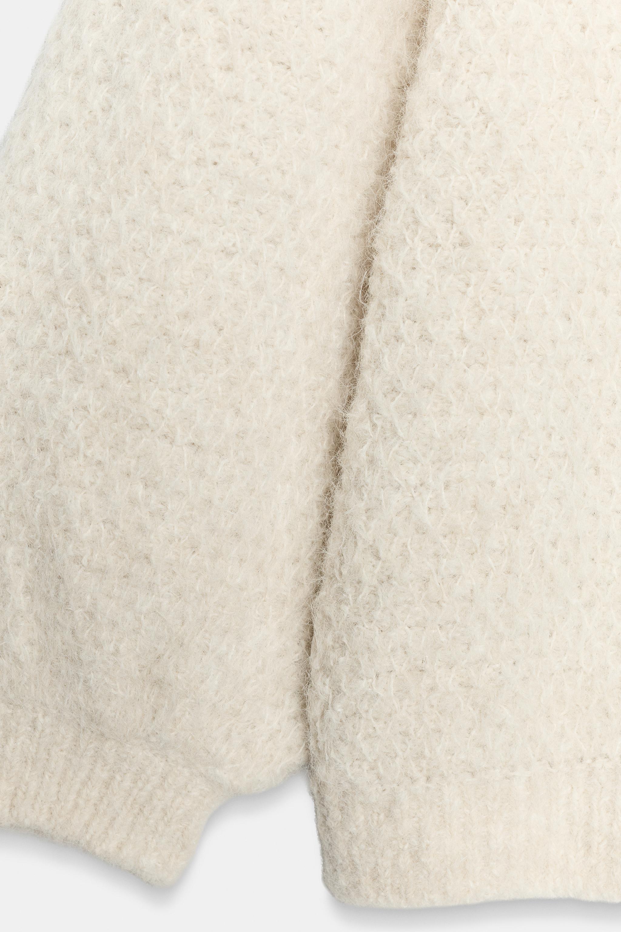 VESTE EN MAILLE À MANCHES BOUFFANTES