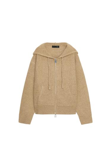 Front view of a toasted hoodie with a zip fastening, front pockets and ribbed trims.
