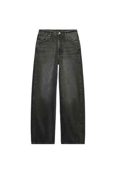 Front view of dark denim jeans with front pockets and button fly.