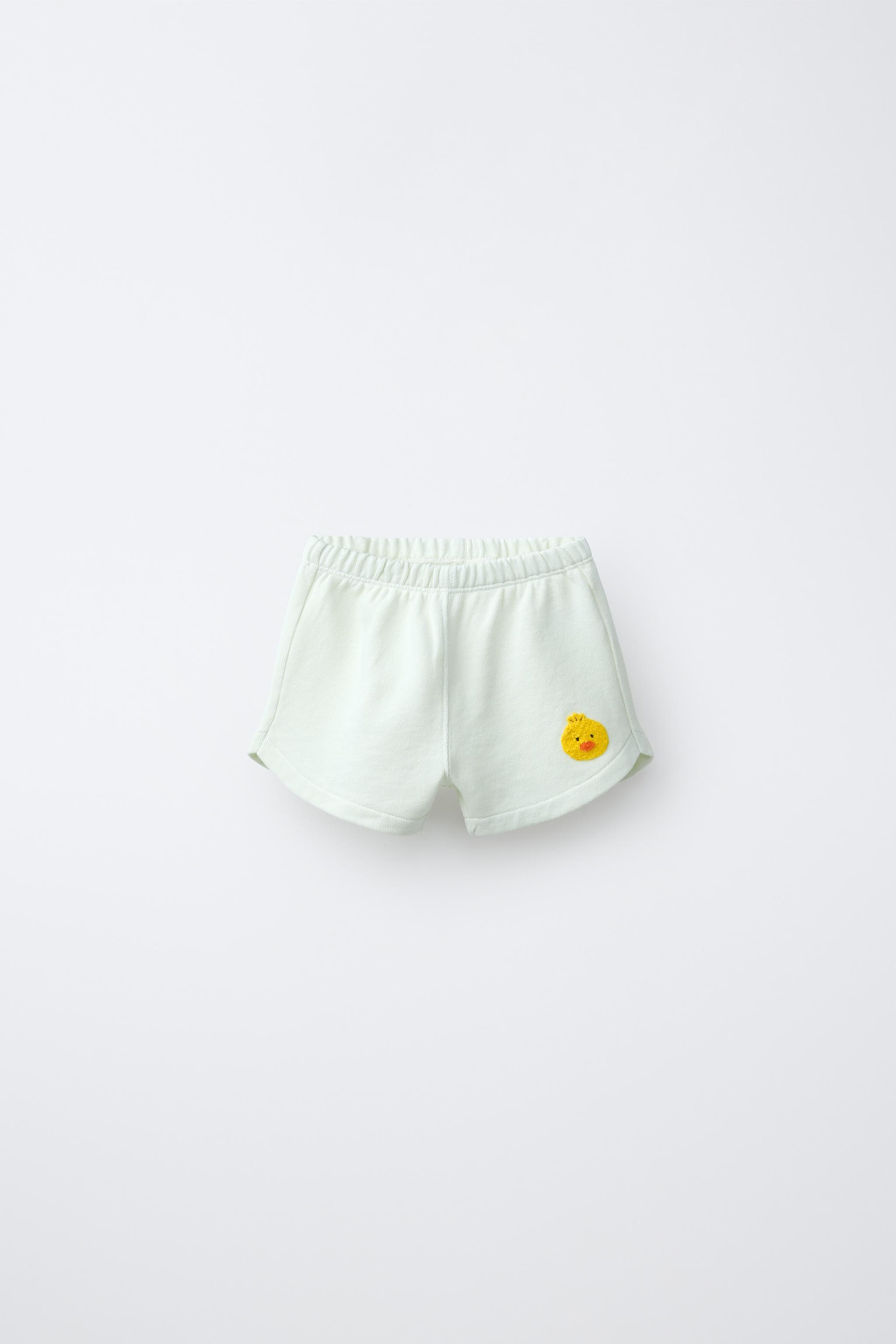 SHORT POUSSIN BRODÉ EN VELOURS BOUCLÉ
