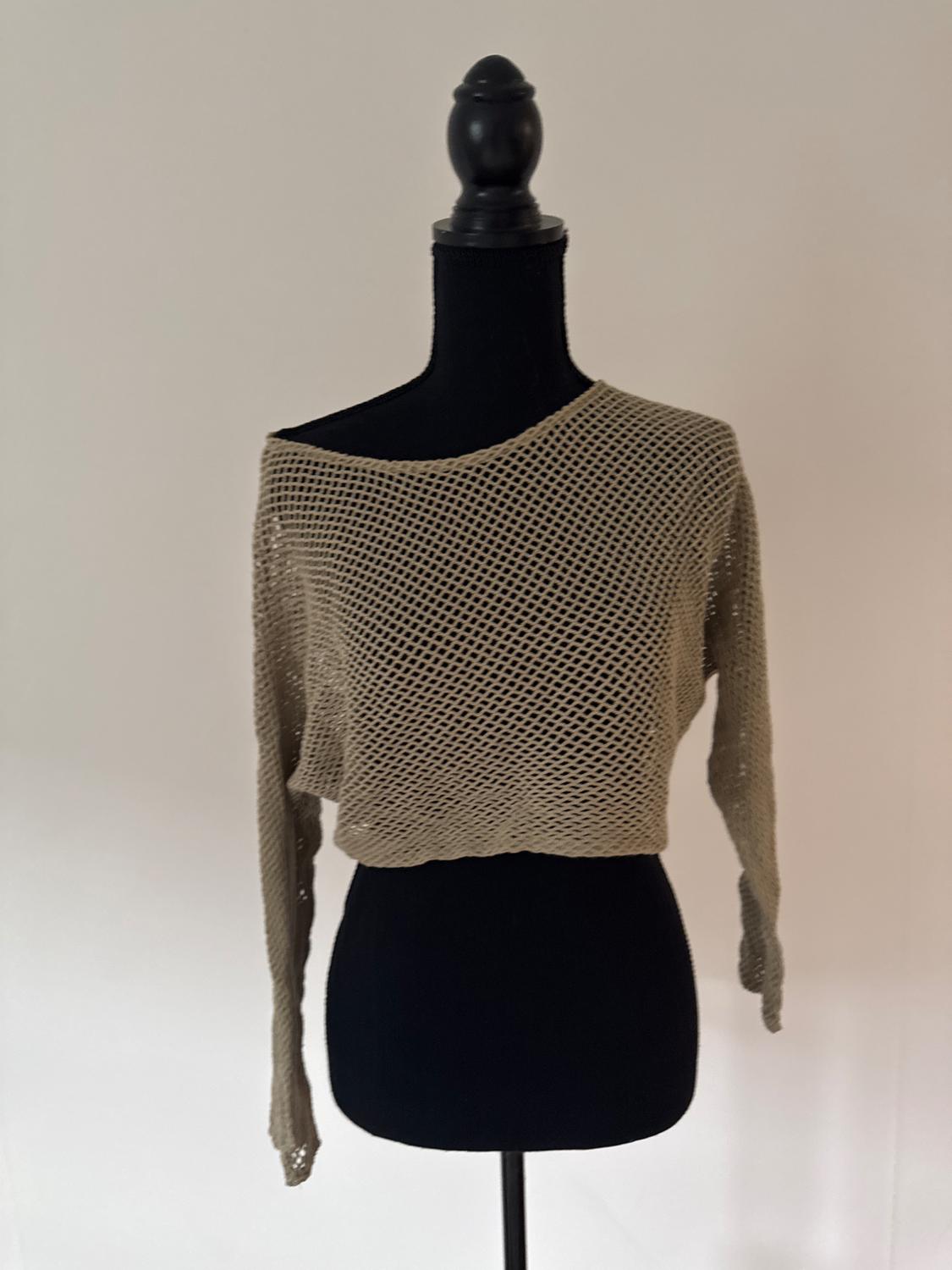 Front view of a beige mesh sweater with a crew neck and long sleeves.