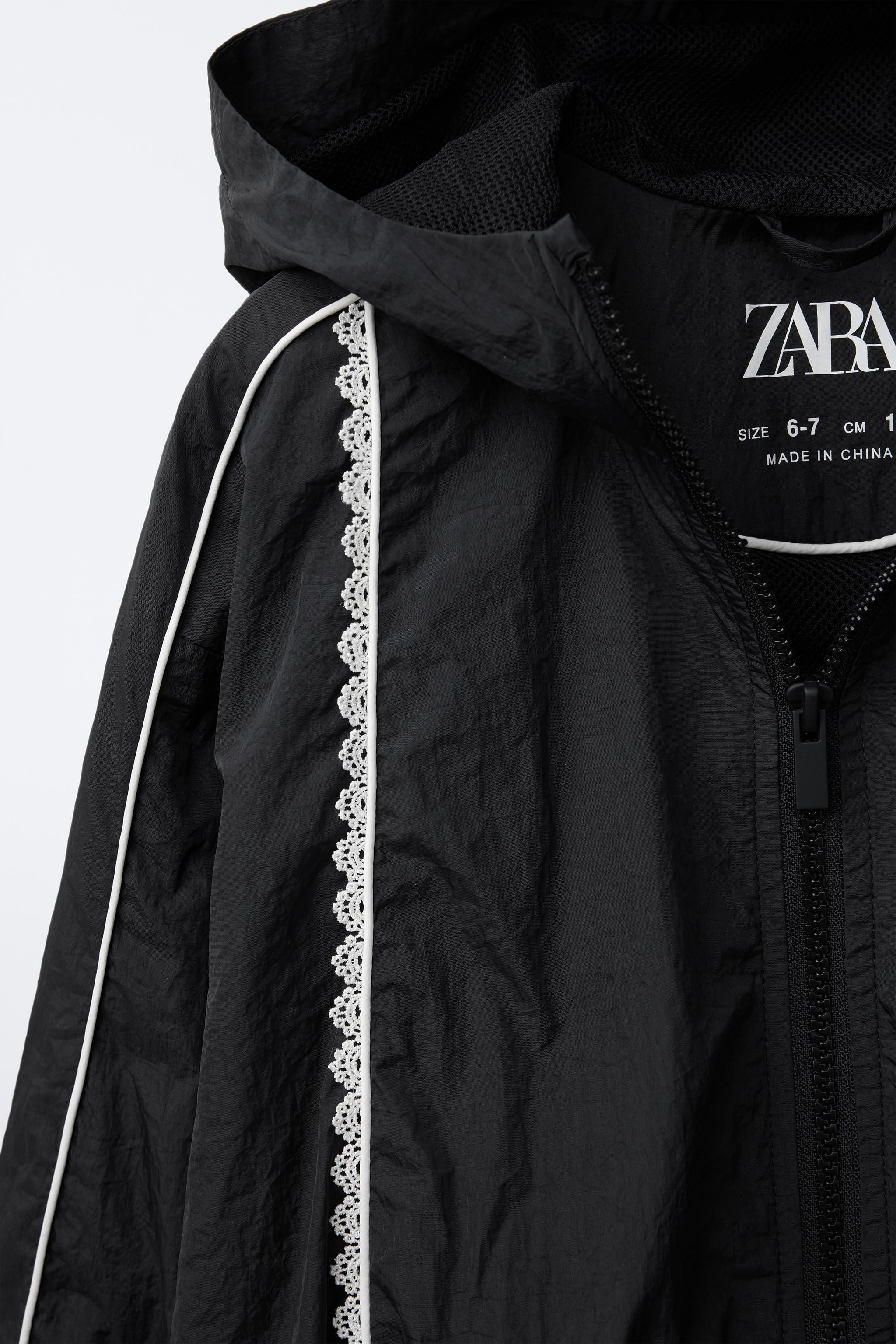［maybe］暗黒の8月 Women's packable rain jacket and windbreaker in black