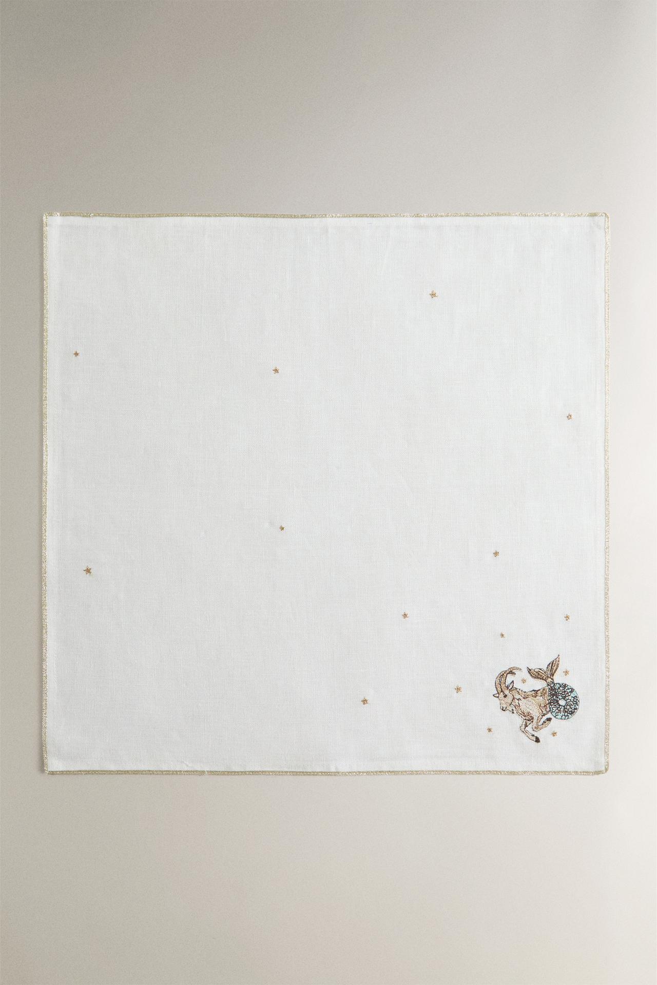 EMBROIDERED LINEN CAPRICORN NAPKIN | MARISA BERENSON — Ecru