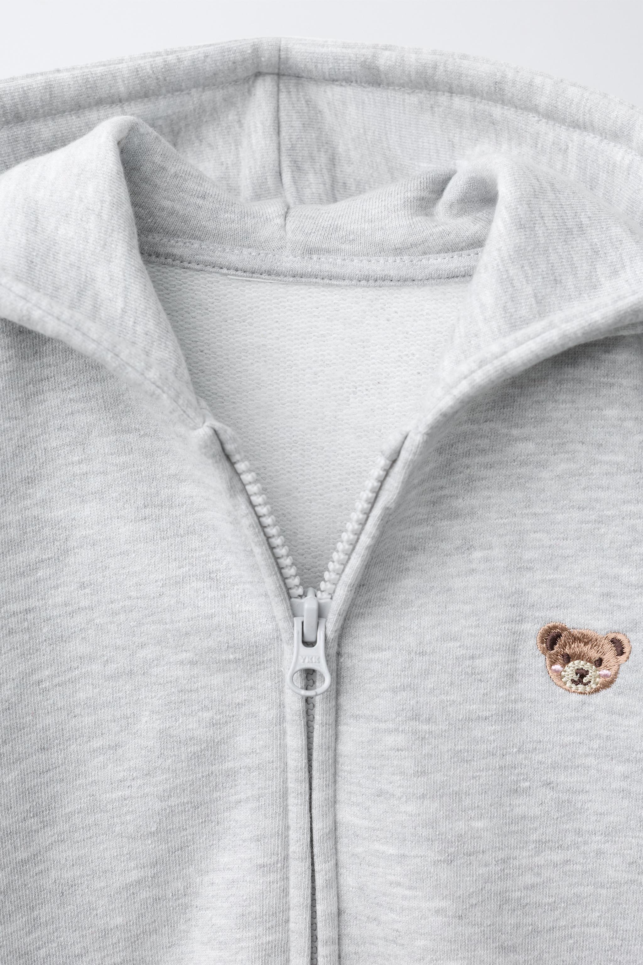 SWEAT ZIPPÉ OURS BRODÉ
