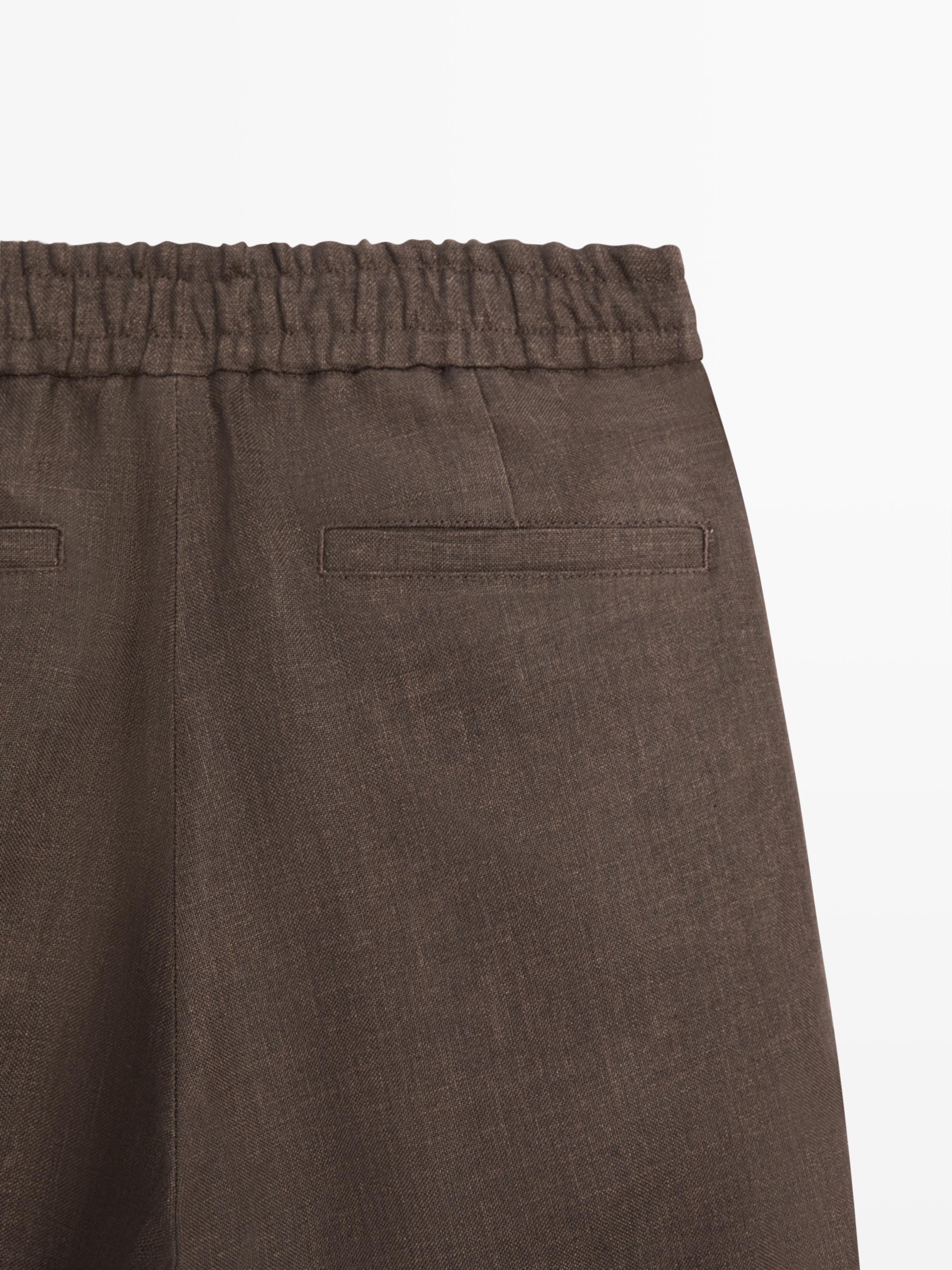 Faded total look linen trousers