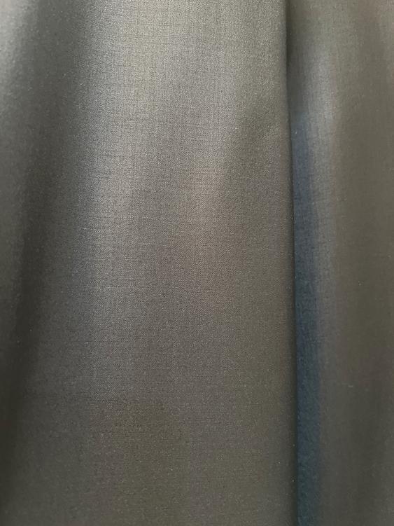 Gray fabric with a soft texture and slight shade variation. There is no text or other visible elements in the image.