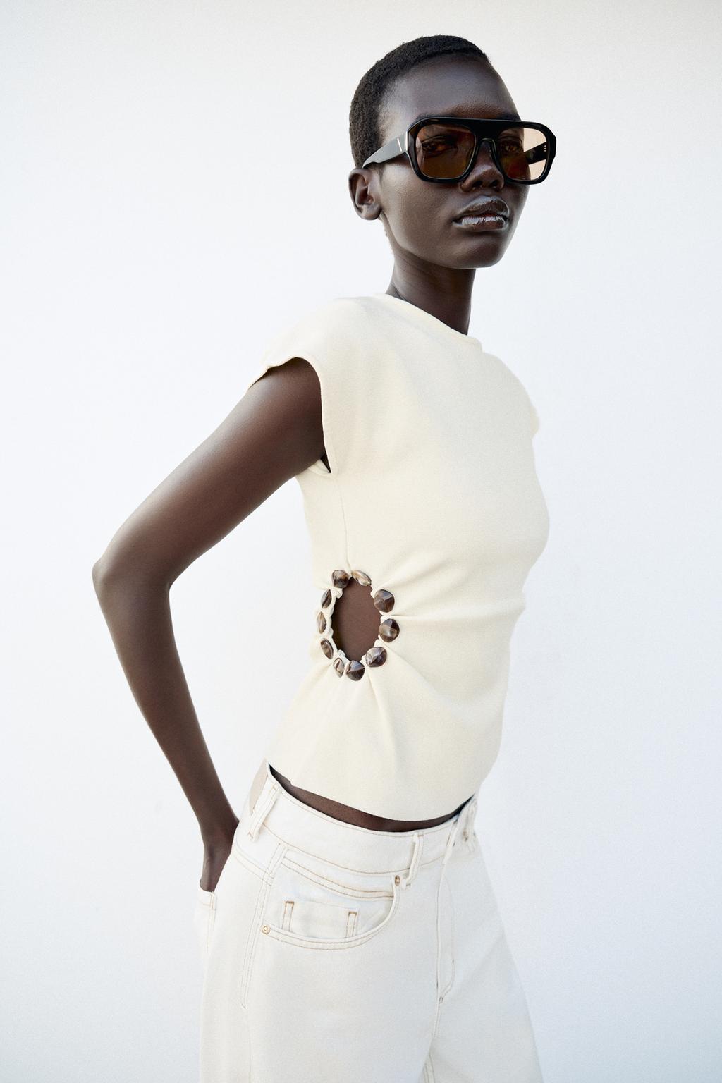 CUT-OUT KNIT TOP WITH BEADS