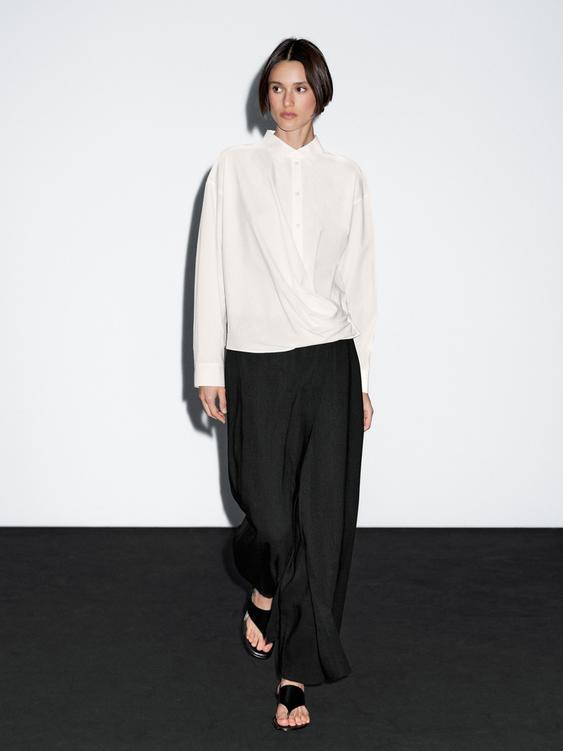 100% cotton shirt with draped asymmetric hem