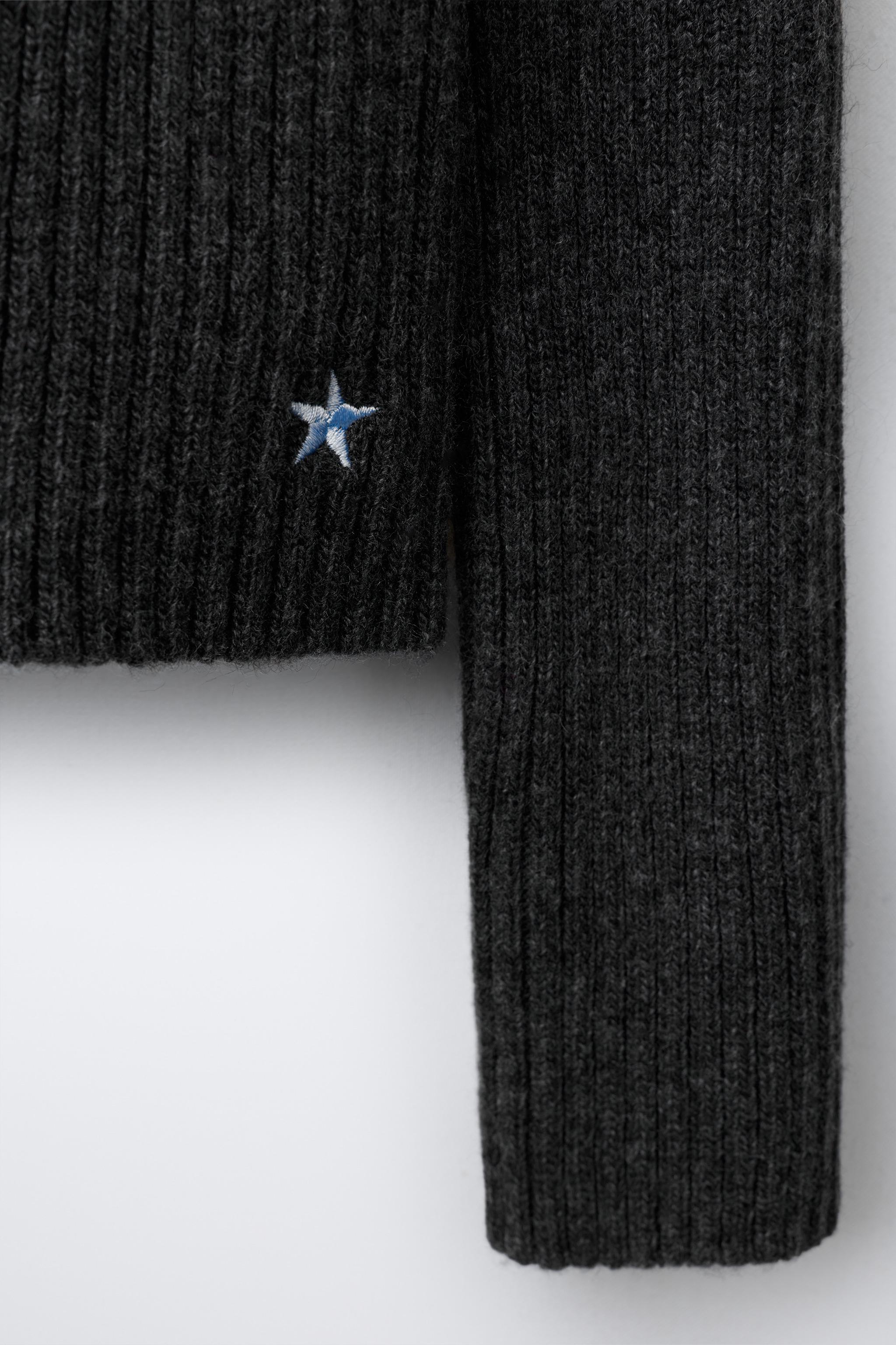 KNIT JUMPER WITH CUT-OUT AND EMBROIDERED STAR
