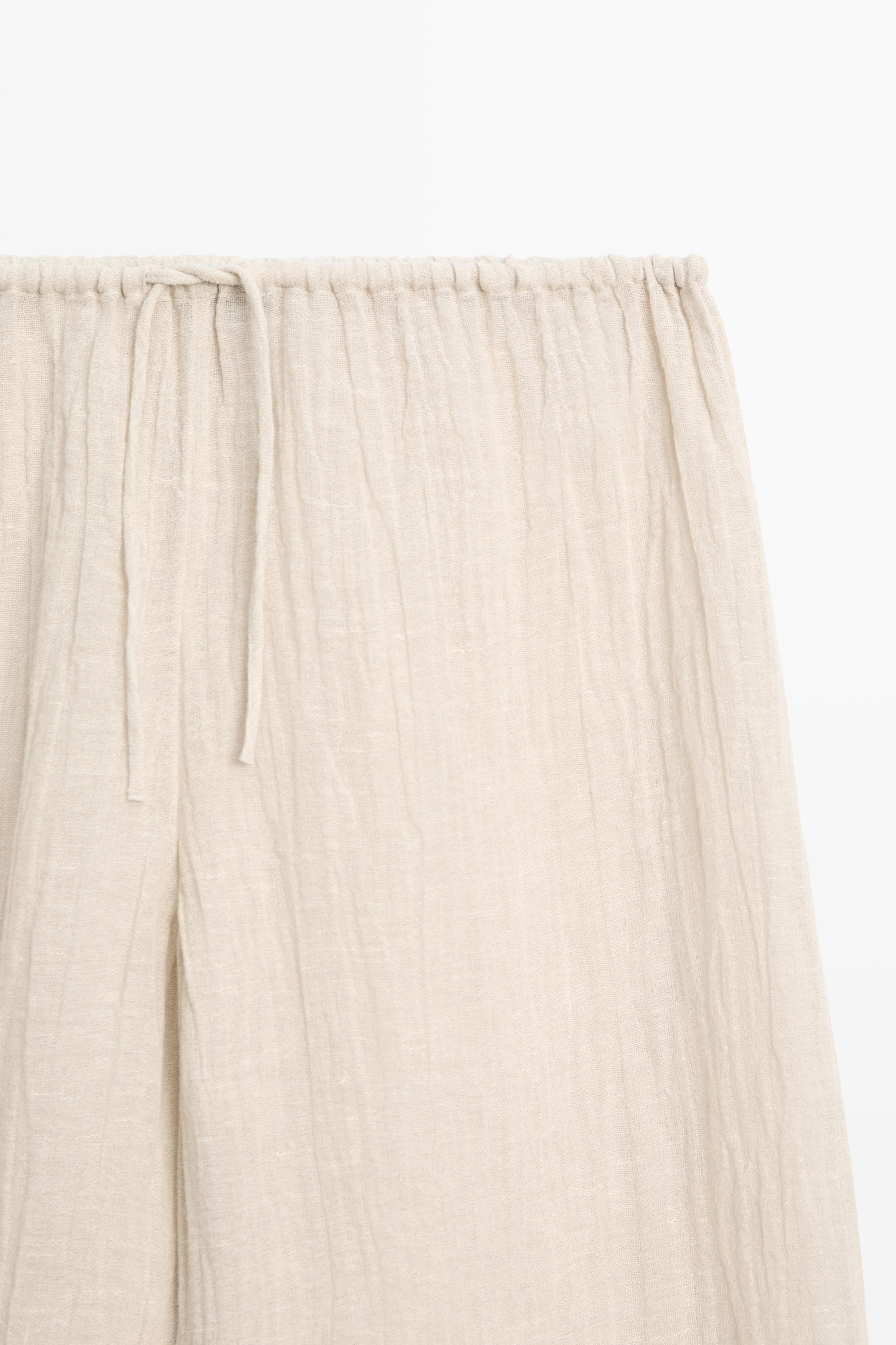 Total look flowing waffle-knit linen blend trousers — Beige marl