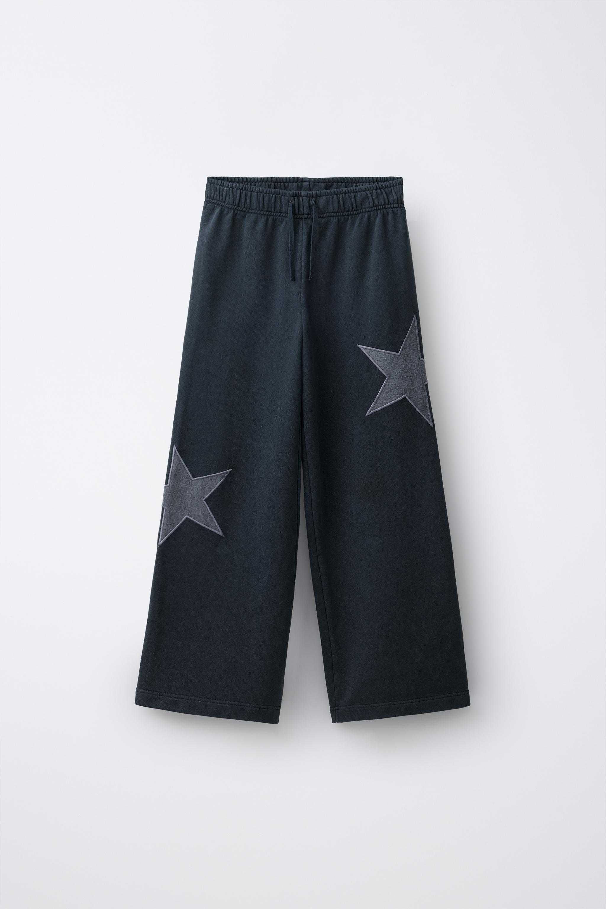 PANTALON EN MOLLETON EFFET DÉLAVÉ À JAMBES LARGES ÉTOILES