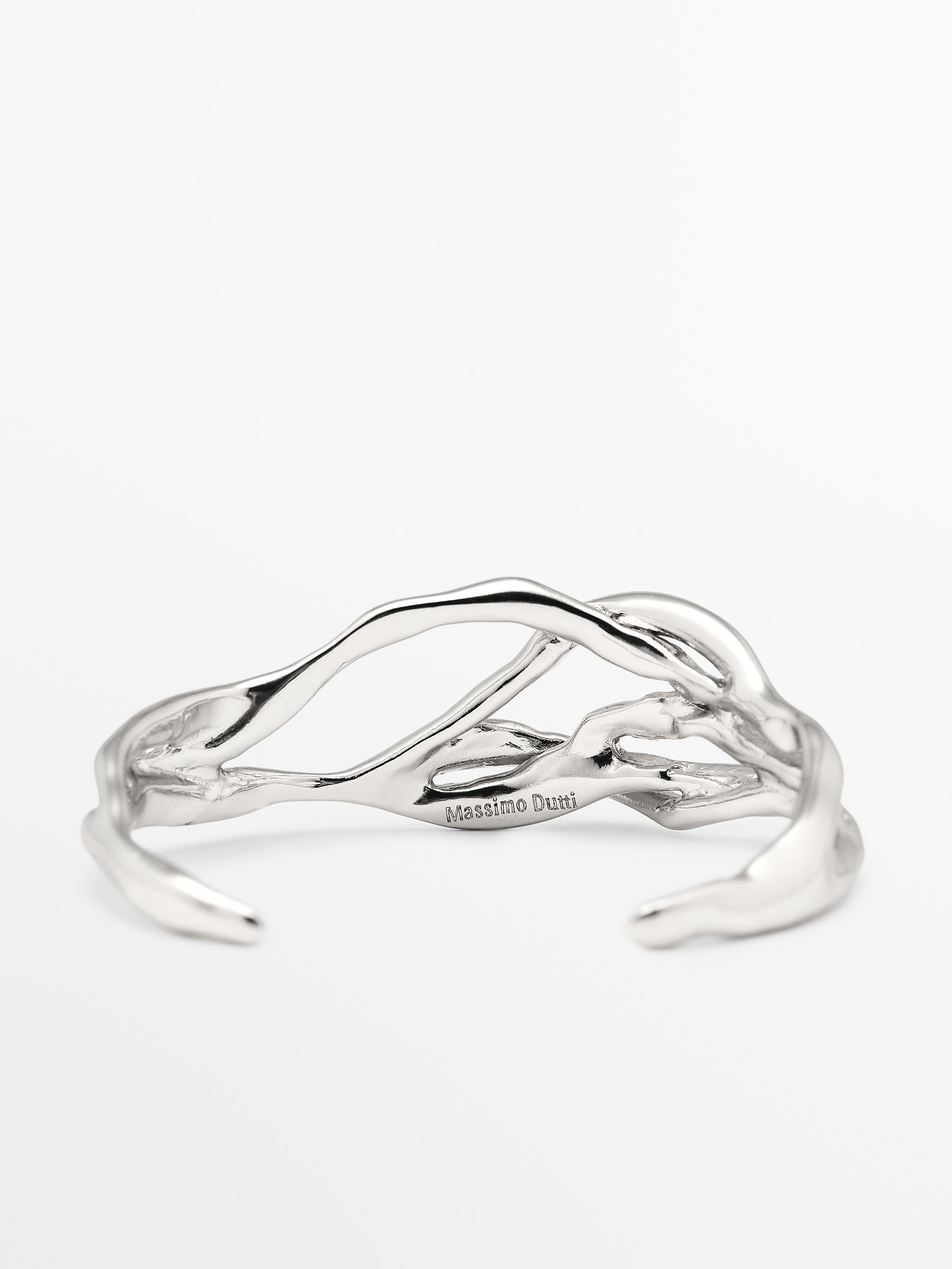 Bracelet métallique abstrait