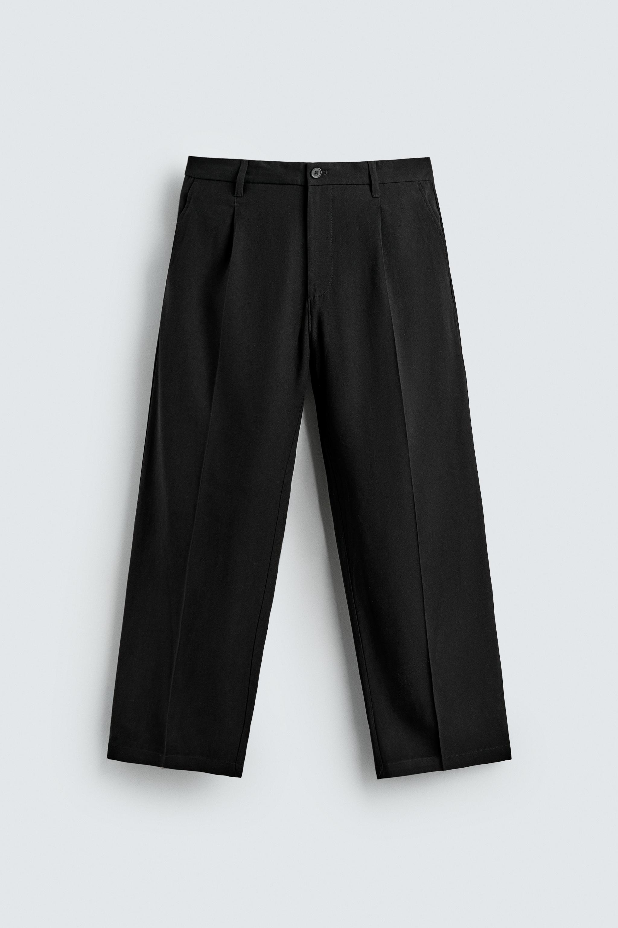 FLOWY RELAXED FIT PLEATED PANTS