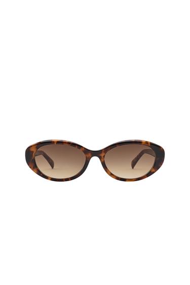Front view of cat-eye sunglasses with a mottled brown frame and gradient lenses.