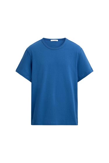 Basic short-sleeved blue T-shirt with a round neck on a white background.