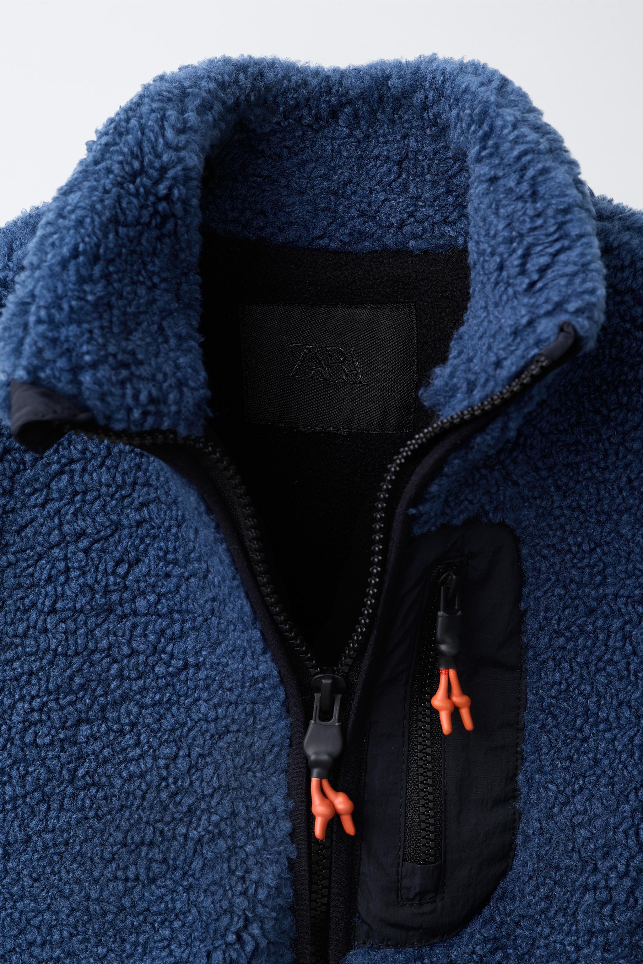 GILET EFFET MOUTON RETOURNÉ CONTRASTANT