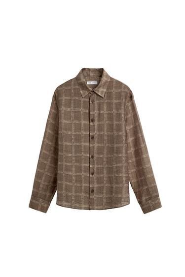 Front view of a toasted plaid shirt. Long-sleeve design with cuffs, spread collar, and front button closure.