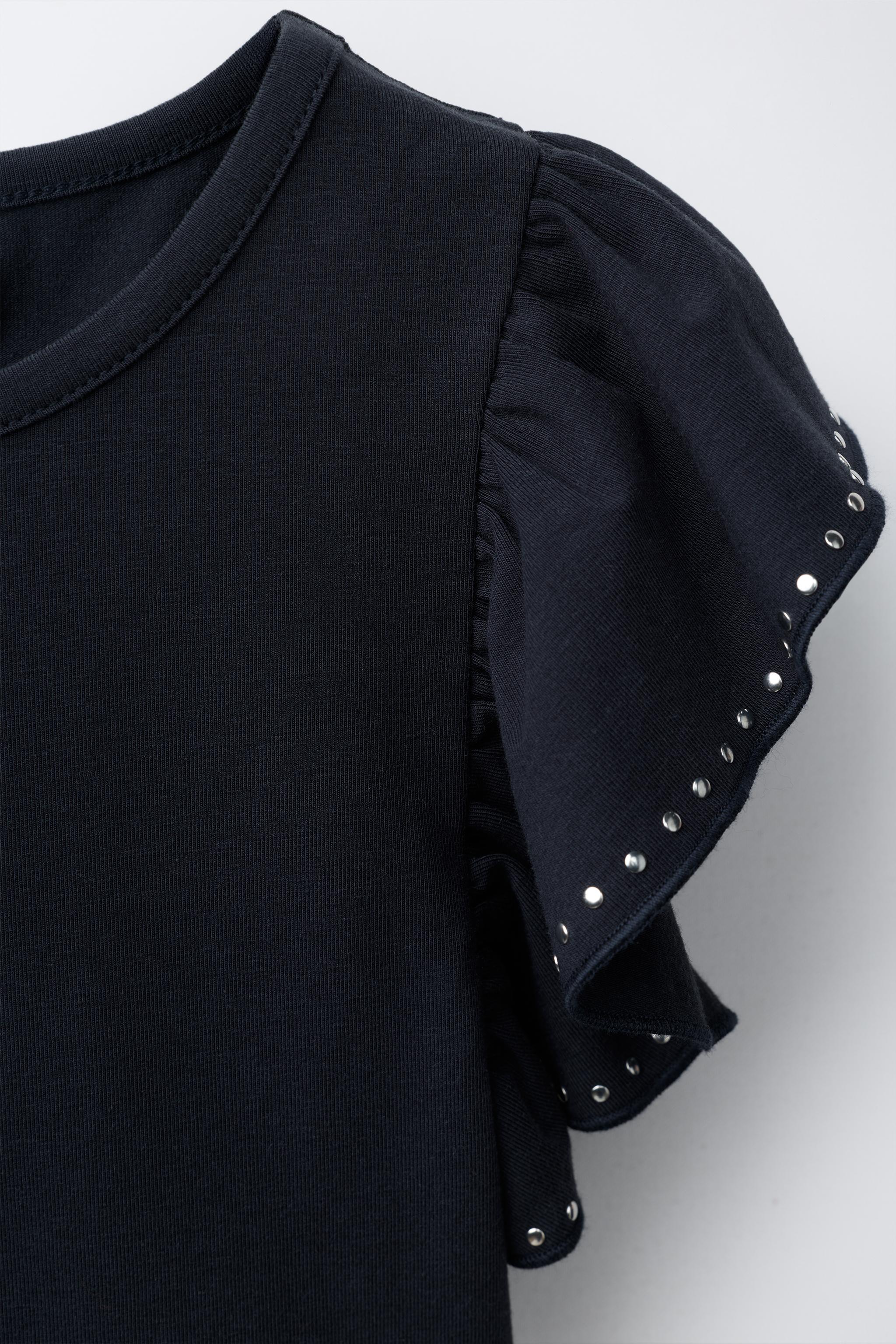 RUFFLED BODYSUIT WITH STUDS AND MODAL