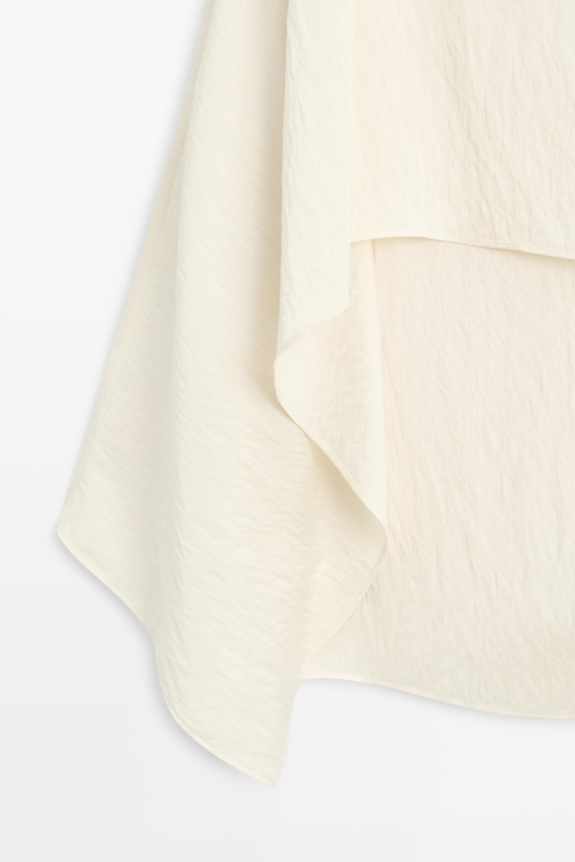 Blouse fluide style cape