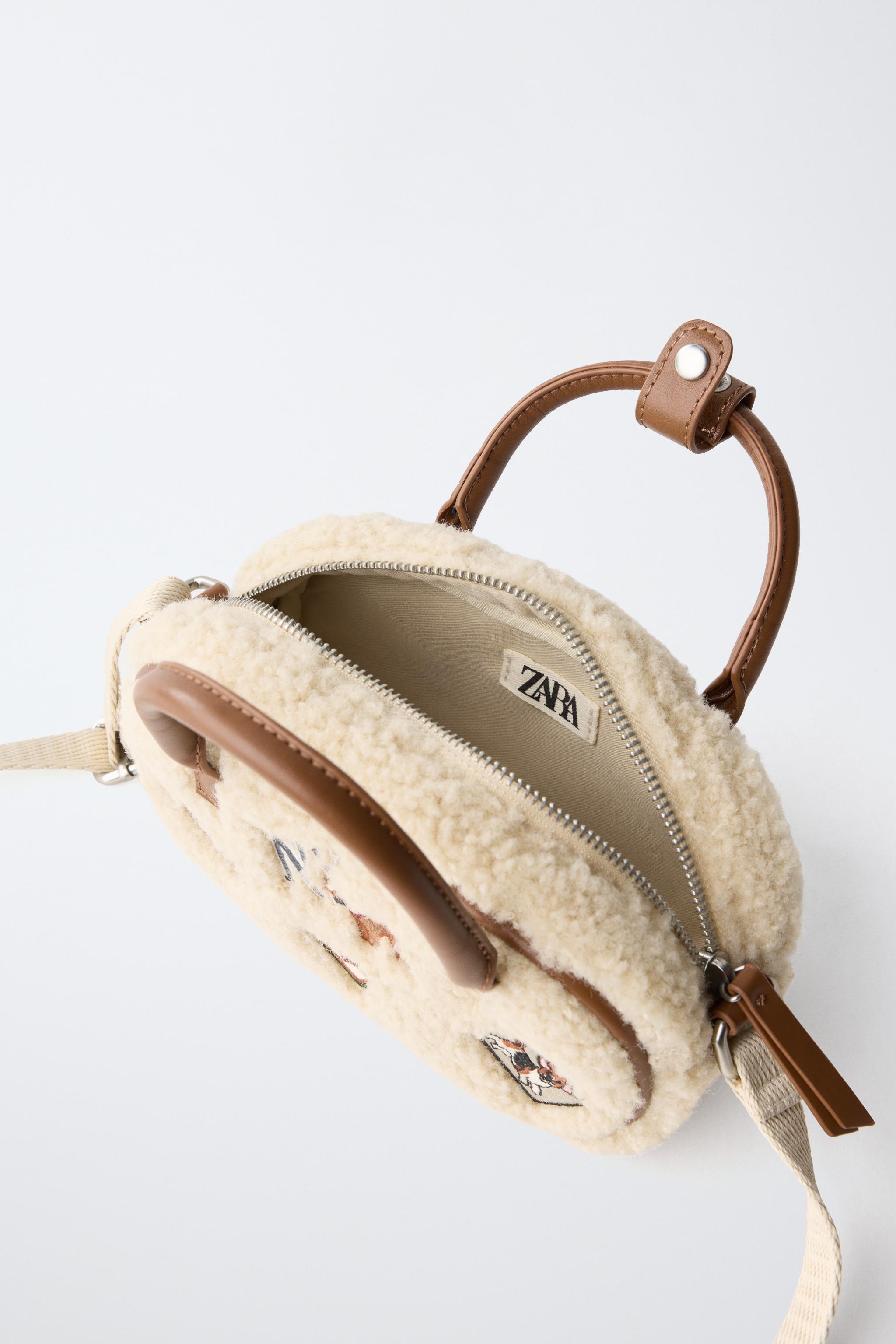 SAC BANDOULIÈRE EN MOUTON RETOURNÉ AVEC PIÈCE
