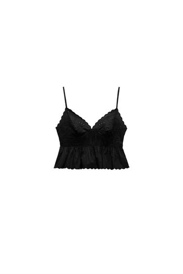 Front view of a black top with thin straps and floral embroidery.