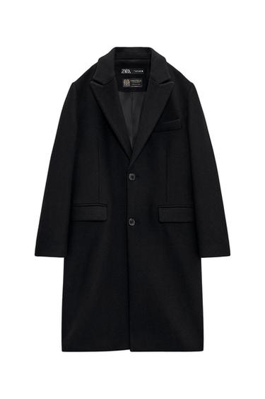 Front view of a black coat with lapels and front flap pockets.