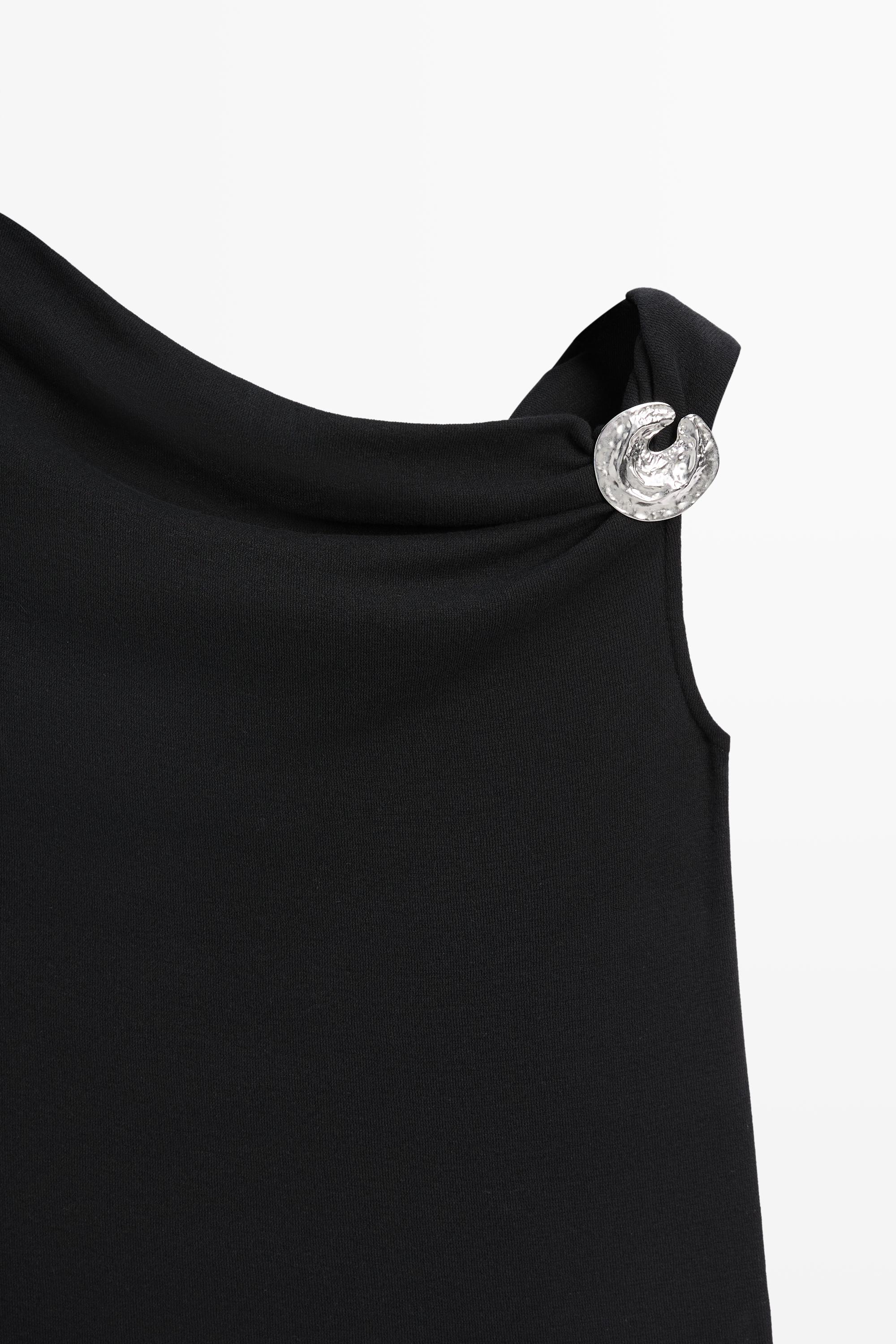 Asymmetric top with rhinestone detail