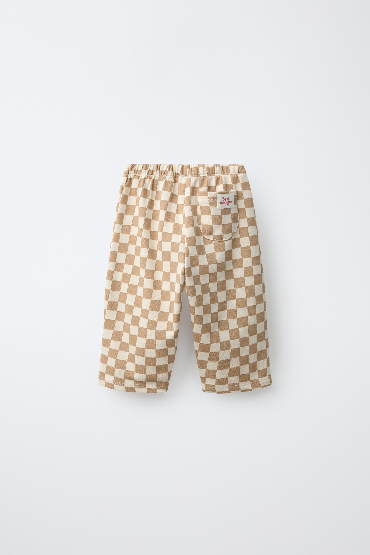 CHECKERBOARD PRINT BAGGY TROUSERS — camel