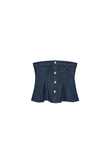 Front view of indigo bandeau top with faux buttons at the front and a flared hem.