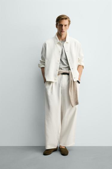 PANTALONS FLUIDS AMB PLECS - Blanc trencat de Zara