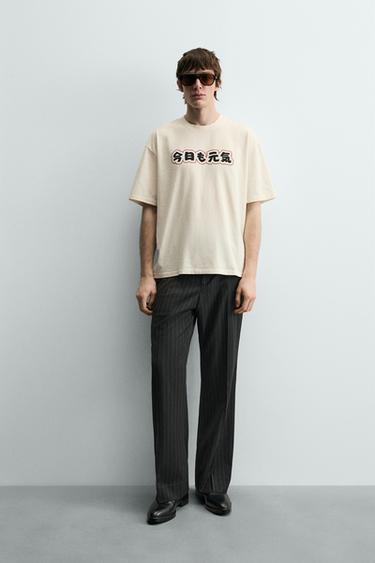 CAMISETA ESTAMPADA EM CONTRASTE - Branco-marfim da Zara - Imagem 0