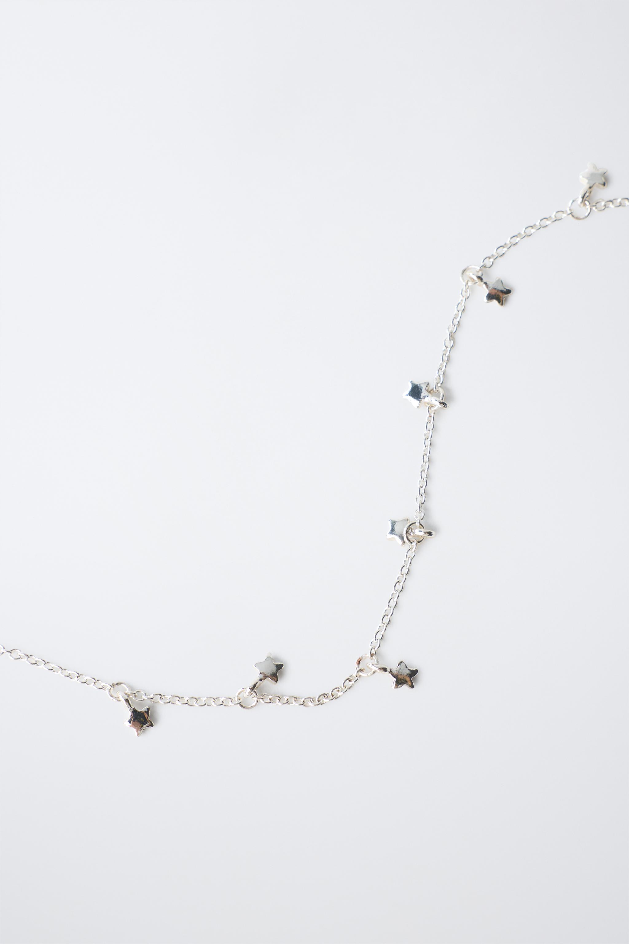 PACK OF TWO STAR NECKLACES — Silver