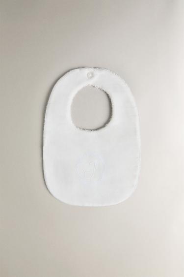 BABERO BEBÉ LETRAS - de Zara