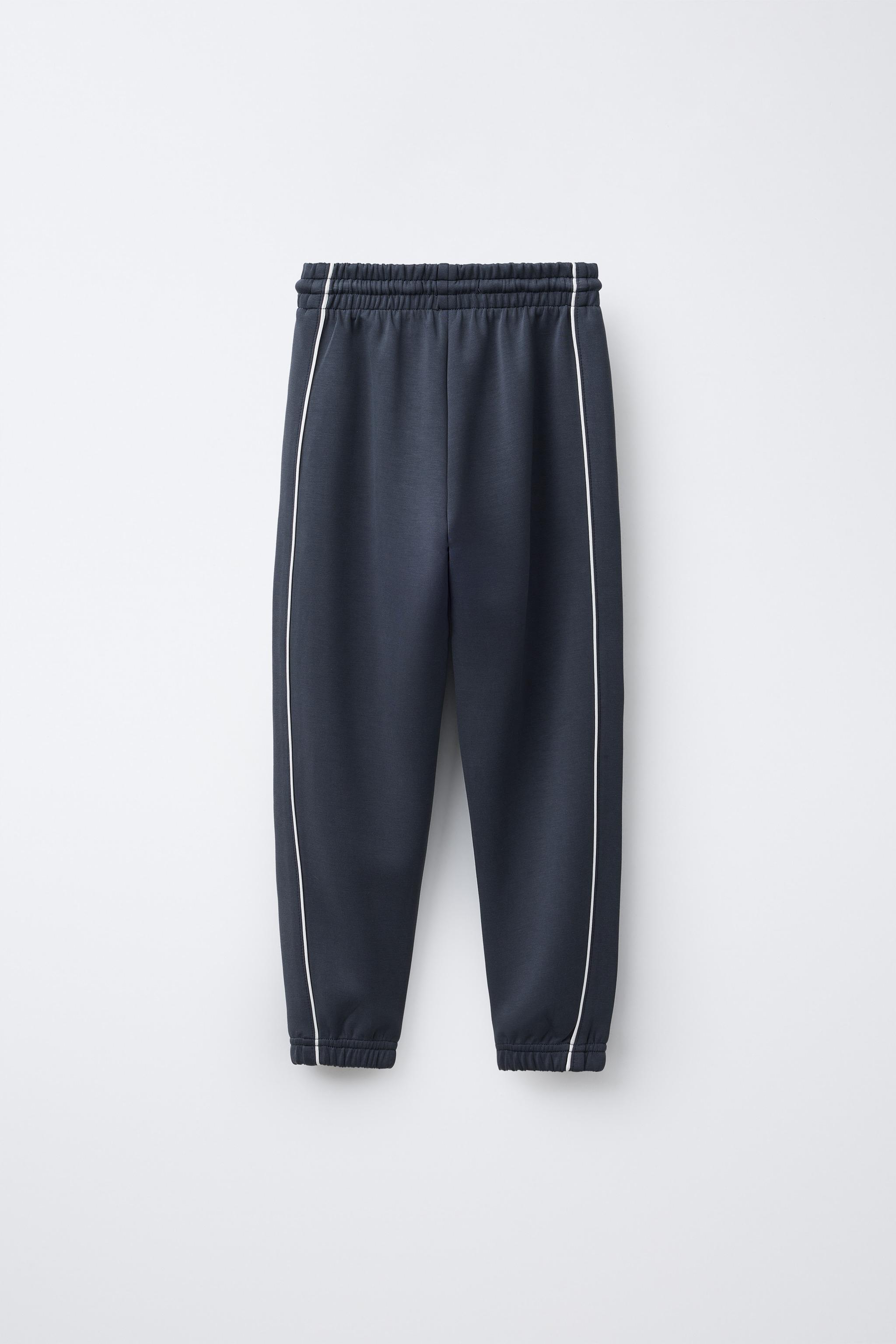JOGGERS WITH CONTRASTING PIPING