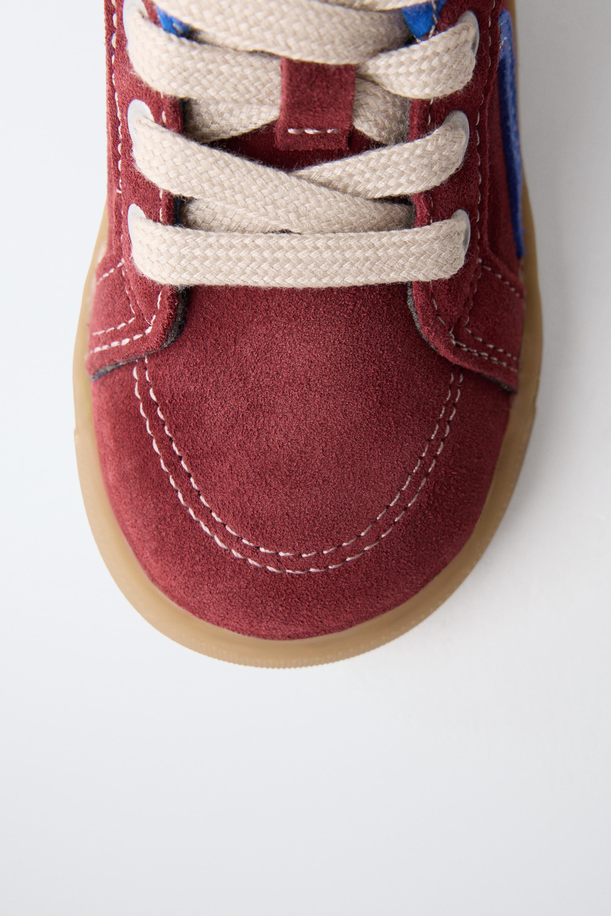 BASKETS MONTANTES EN CUIR