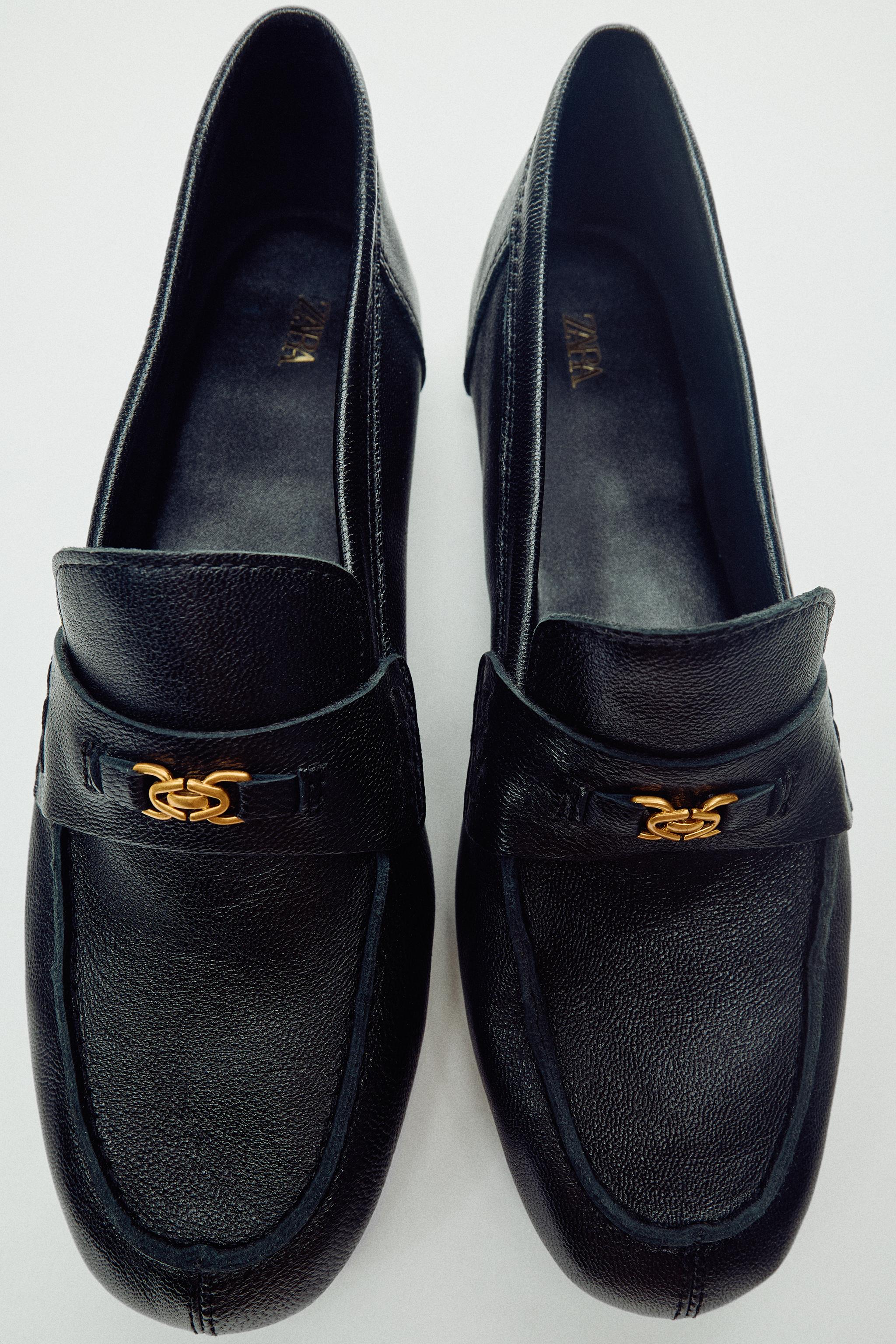 LEATHER LOAFERS WITH METAL APPLIQUÉ