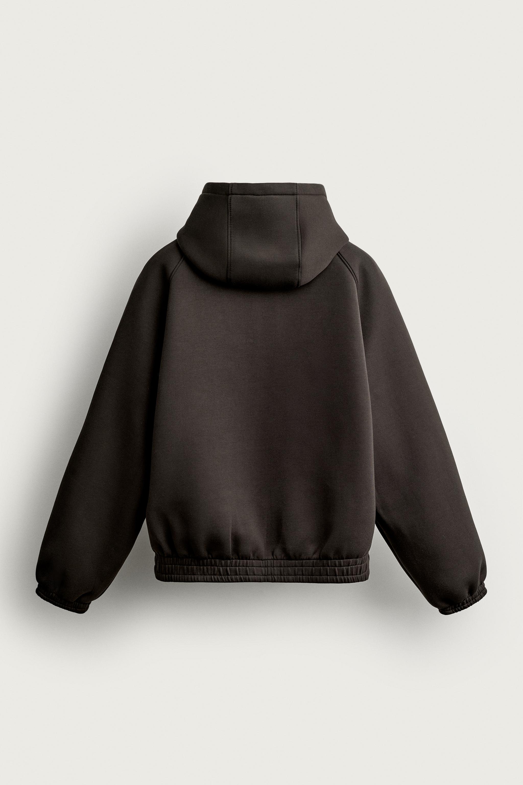 VESTE TECHNIQUE À CAPUCHE RELAXED FIT