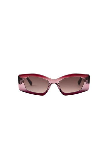 Rectangular sunglasses with red frames and dark lenses on a white background.