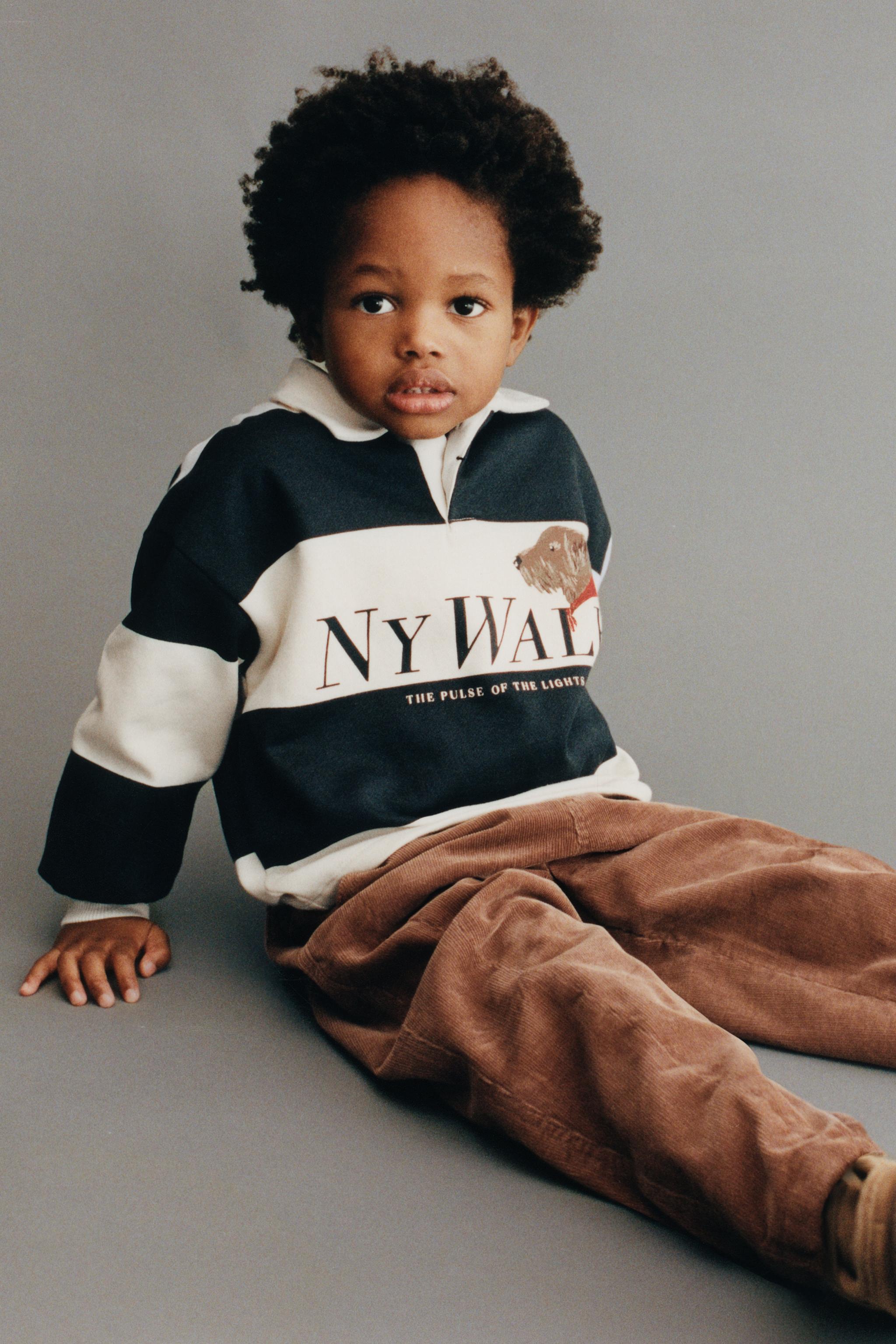 PANTALON EN VELOURS CÔTELÉ BOUTONS DOUBLÉ