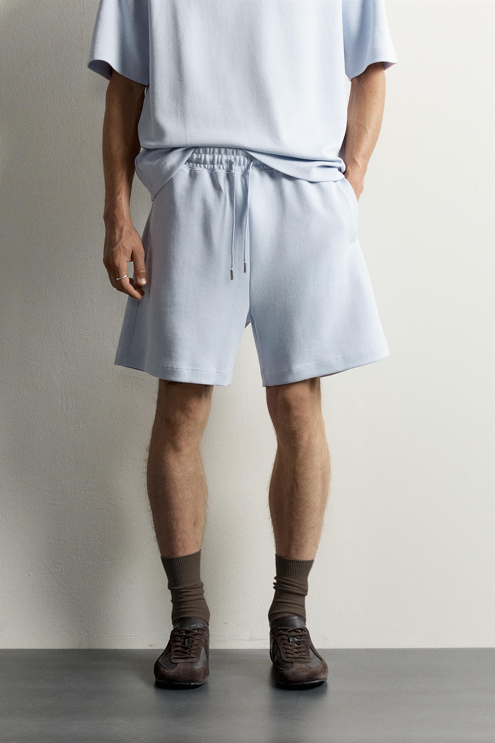 RELAXED FIT INTERLOCK TRACK SHORTS — Sky blue