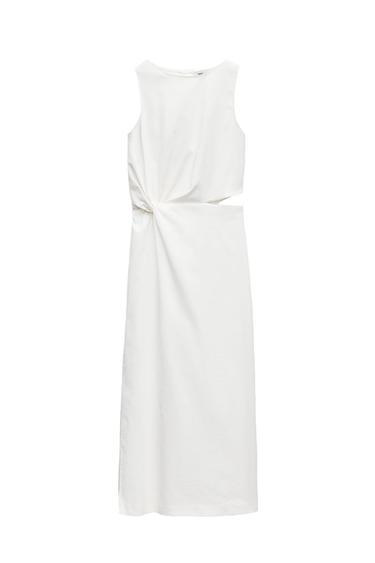 Sleeveless white dress with a knotted detail and waist cutout, against a white background.